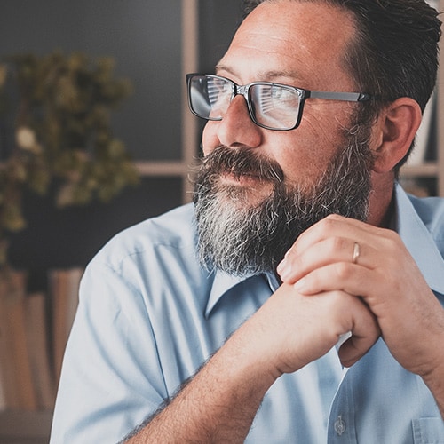 A man considering whether investing in identity theft protection is worth it.