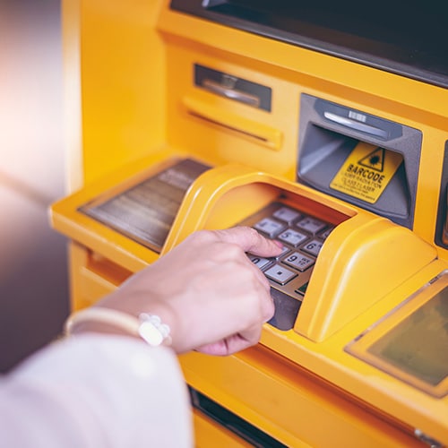 A woman pays for a transaction with her smartphone.