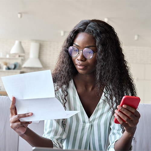 A woman reviewing the steps to take following the exposure of her SSN.